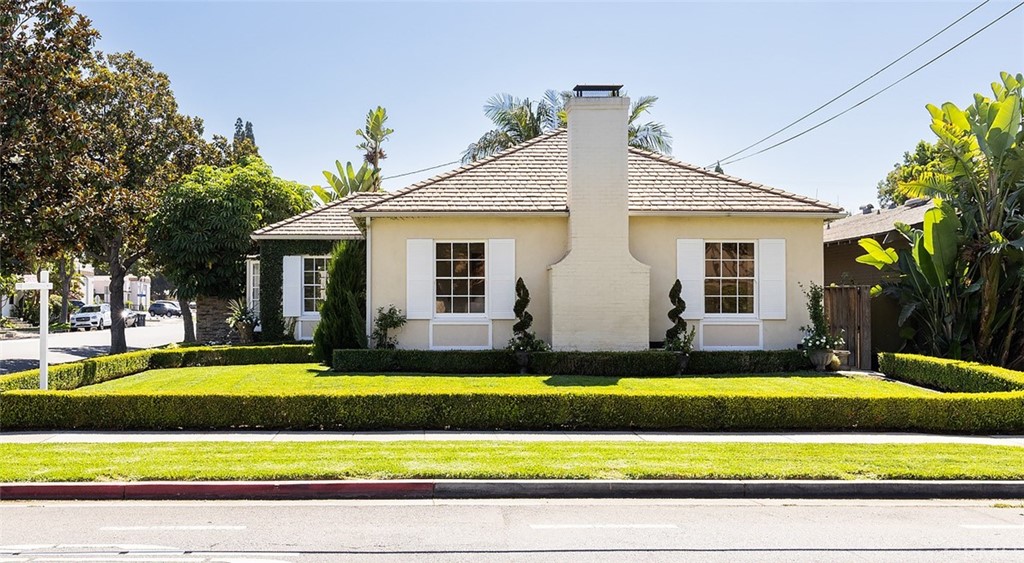 910 East Maple Avenue Orange, CA 92866 - Photo 3 of 38 a view of a house with a yard