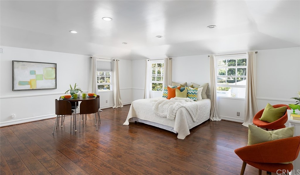 910 East Maple Avenue Orange, CA 92866 - Photo 31 of 38 a bedroom with bed and wooden floor