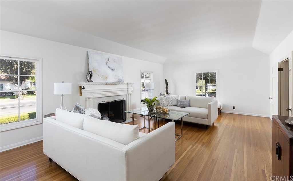 910 East Maple Avenue Orange, CA 92866 - Photo 8 of 38 a living room with furniture and a fireplace