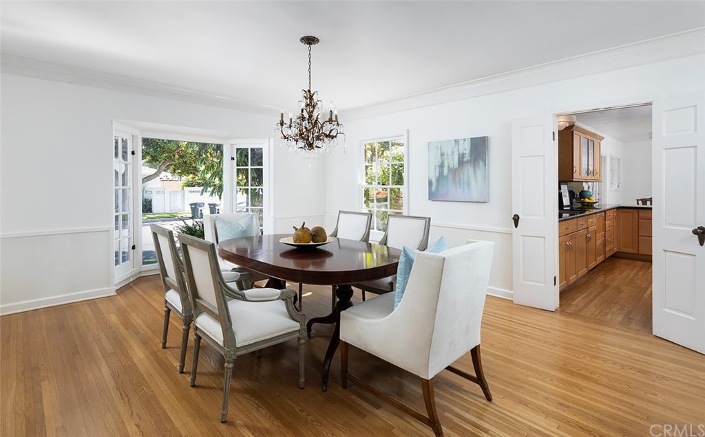 910 East Maple Avenue Orange, CA 92866 - Photo 9 of 38 a view of a dining room with furniture wooden floor and chandelier