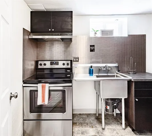 a kitchen with a stove and a microwave