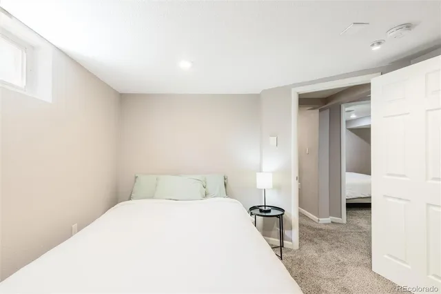 a bedroom with a bed and a view of bathroom