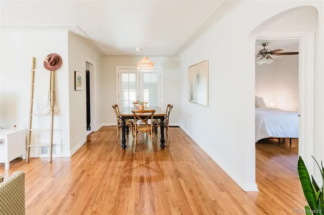 a view of a dining room with furniture window and wooden floor
