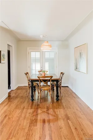 a view of a dining room with furniture and window