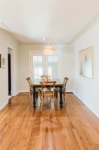 a view of a dining room with furniture and window
