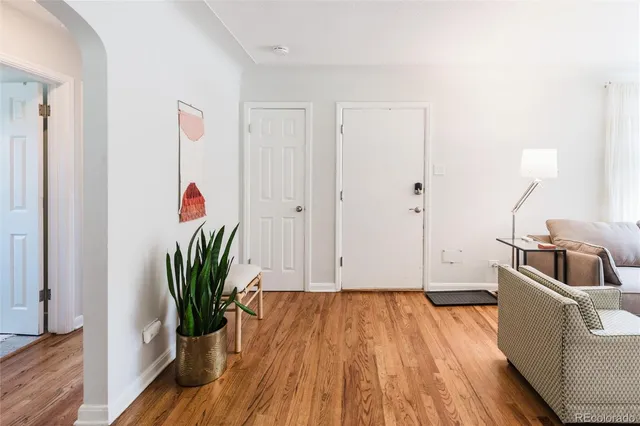 a view of a room with wooden floor and sink