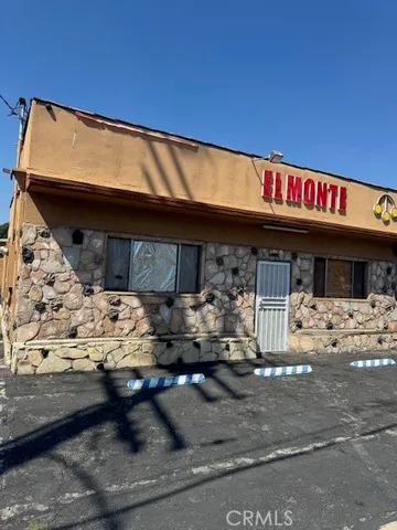 a front view of a building with parking