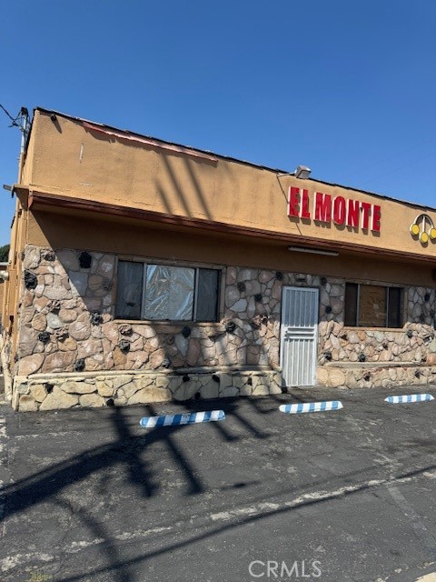 a front view of a building with parking
