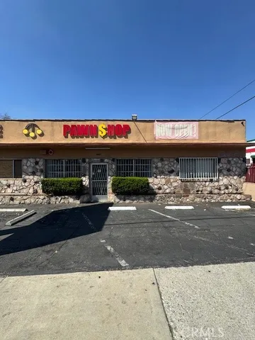 a view of a building with retail shops