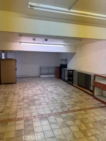 a room with a furniture and a fireplace