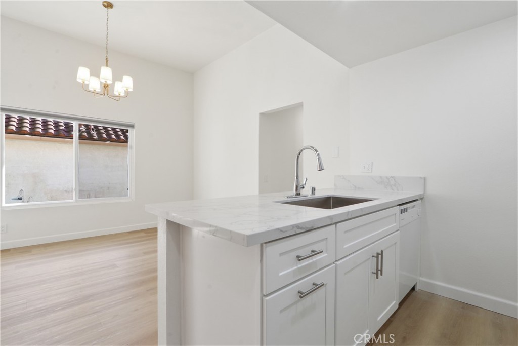 22 Fabriano Irvine, CA 92620 - Photo 12 of 20 a bathroom with a sink a mirror and vanity