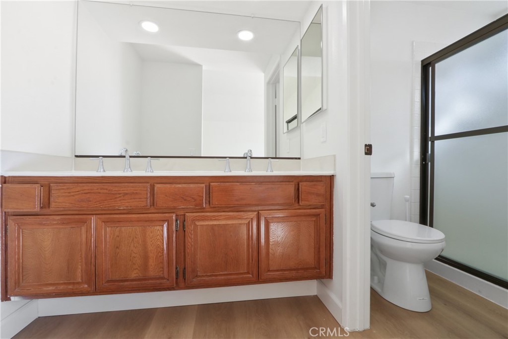 22 Fabriano Irvine, CA 92620 - Photo 15 of 20 a bathroom with a sink a toilet and mirror