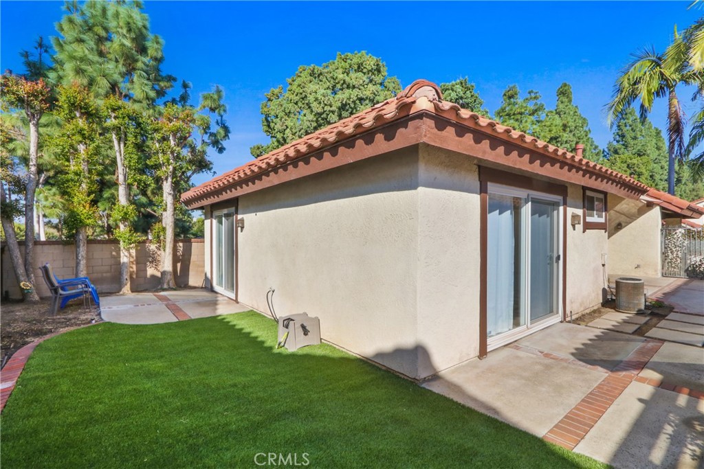 22 Fabriano Irvine, CA 92620 - Photo 20 of 20 a backyard of a house with table and chairs plants and large tree