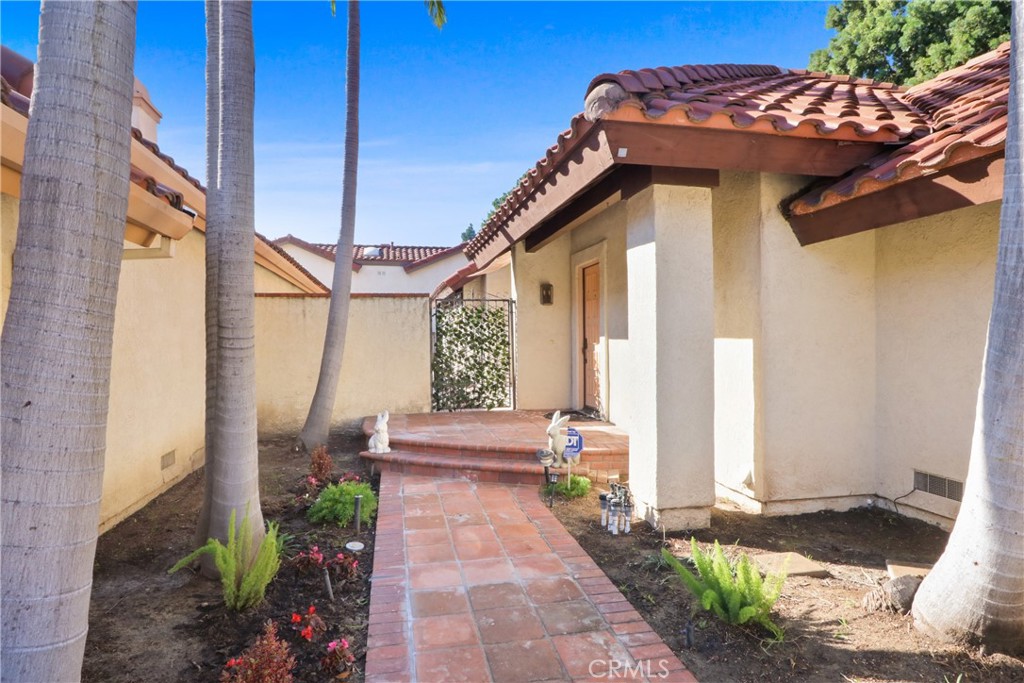 22 Fabriano Irvine, CA 92620 - Photo 3 of 20 a view of a house with a small yard and floor to ceiling windows