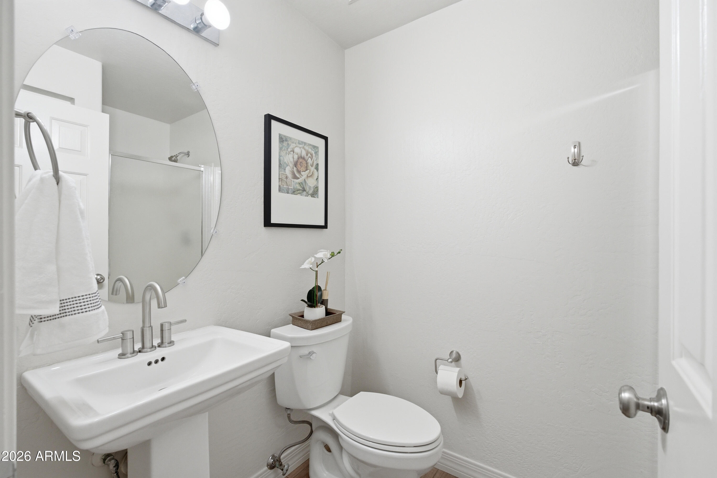 418 South Burk Street Gilbert, AZ 85296 - Photo 32 of 90 a bathroom with a toilet a sink and mirror