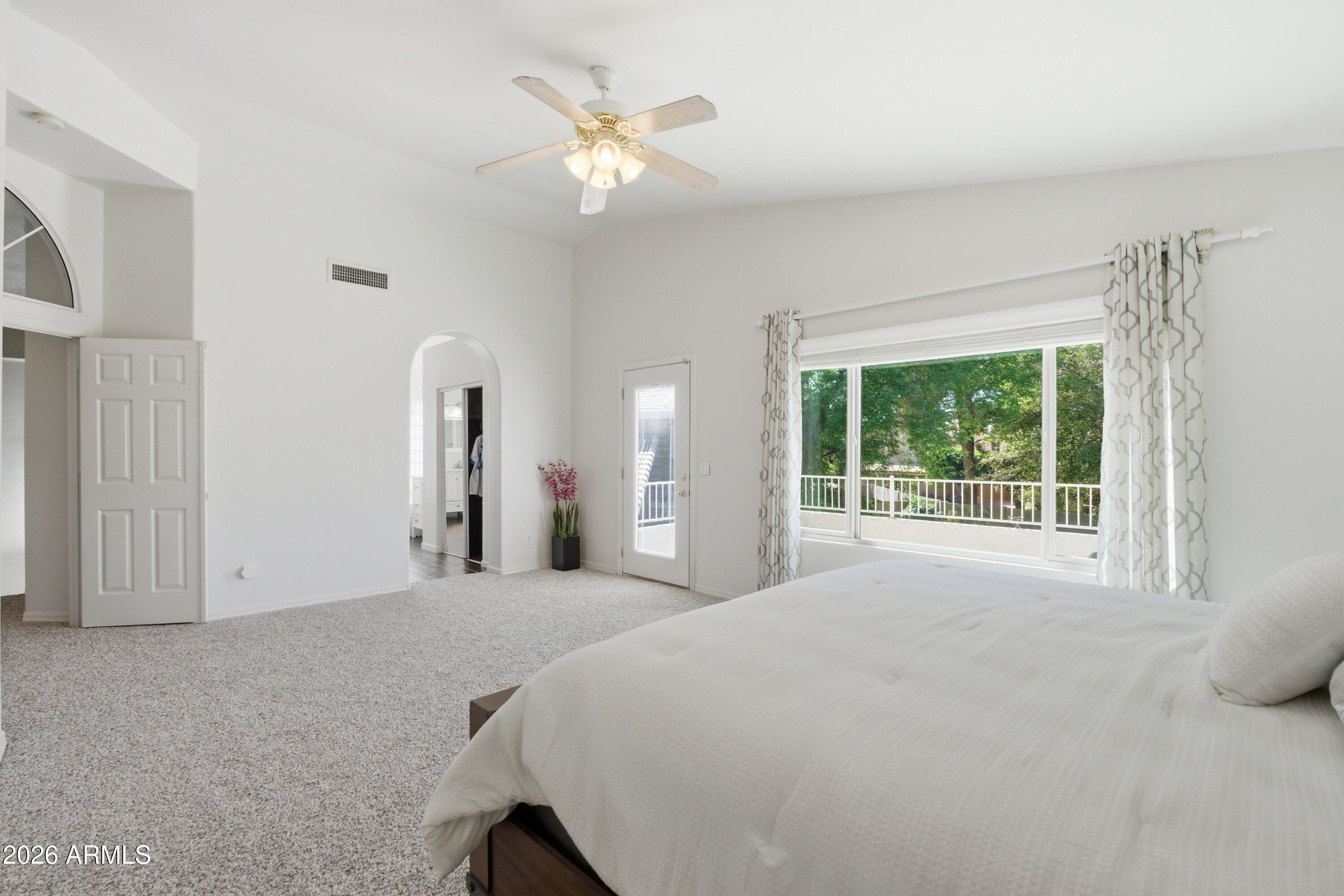 418 South Burk Street Gilbert, AZ 85296 - Photo 36 of 90 a large white bed sitting in a room next to a window