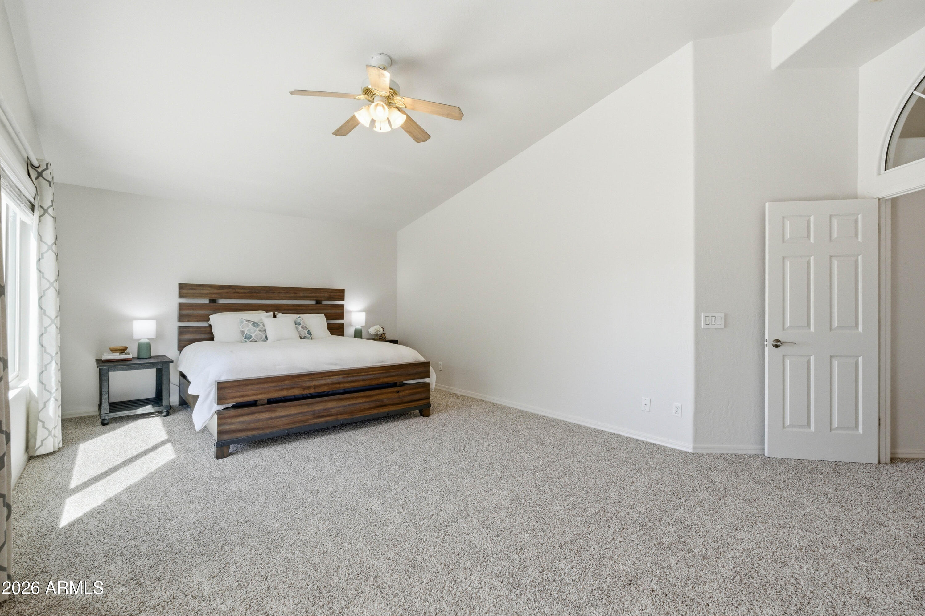 418 South Burk Street Gilbert, AZ 85296 - Photo 38 of 90 a bedroom with a bed and a chandelier