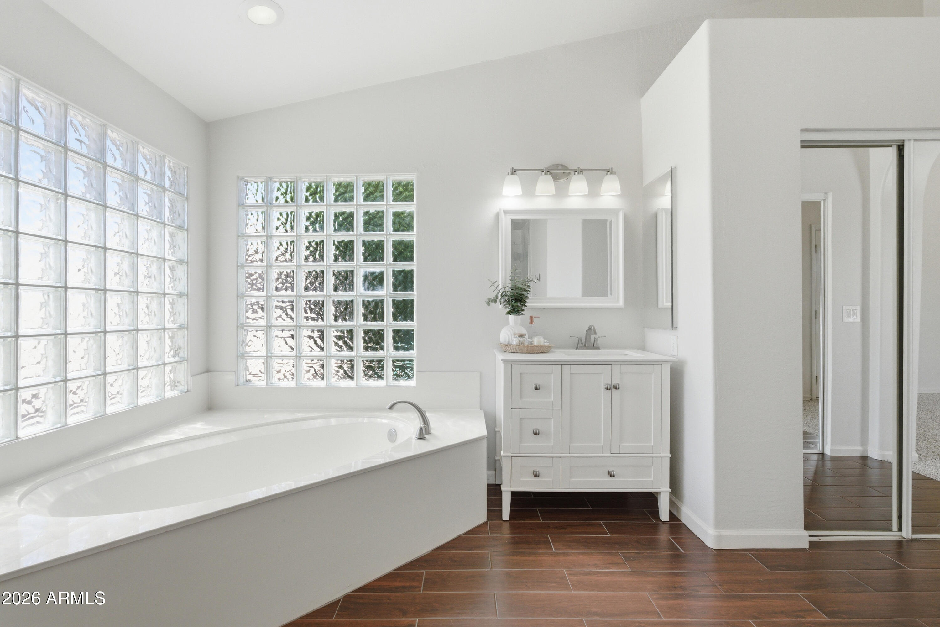418 South Burk Street Gilbert, AZ 85296 - Photo 43 of 90 a bathroom with a bathtub sink and mirror