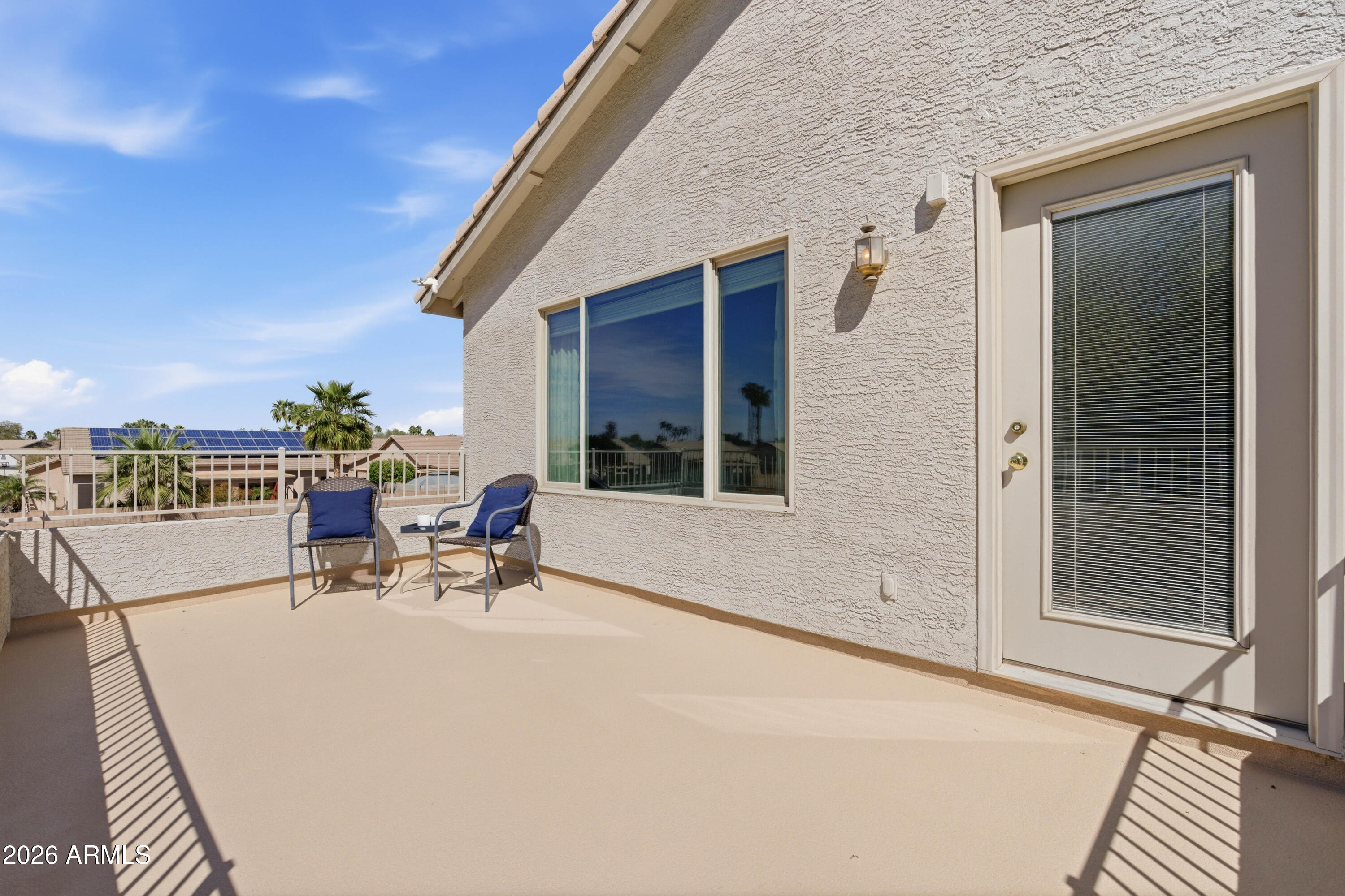 418 South Burk Street Gilbert, AZ 85296 - Photo 46 of 90 a view of a chair and tables in the balcony