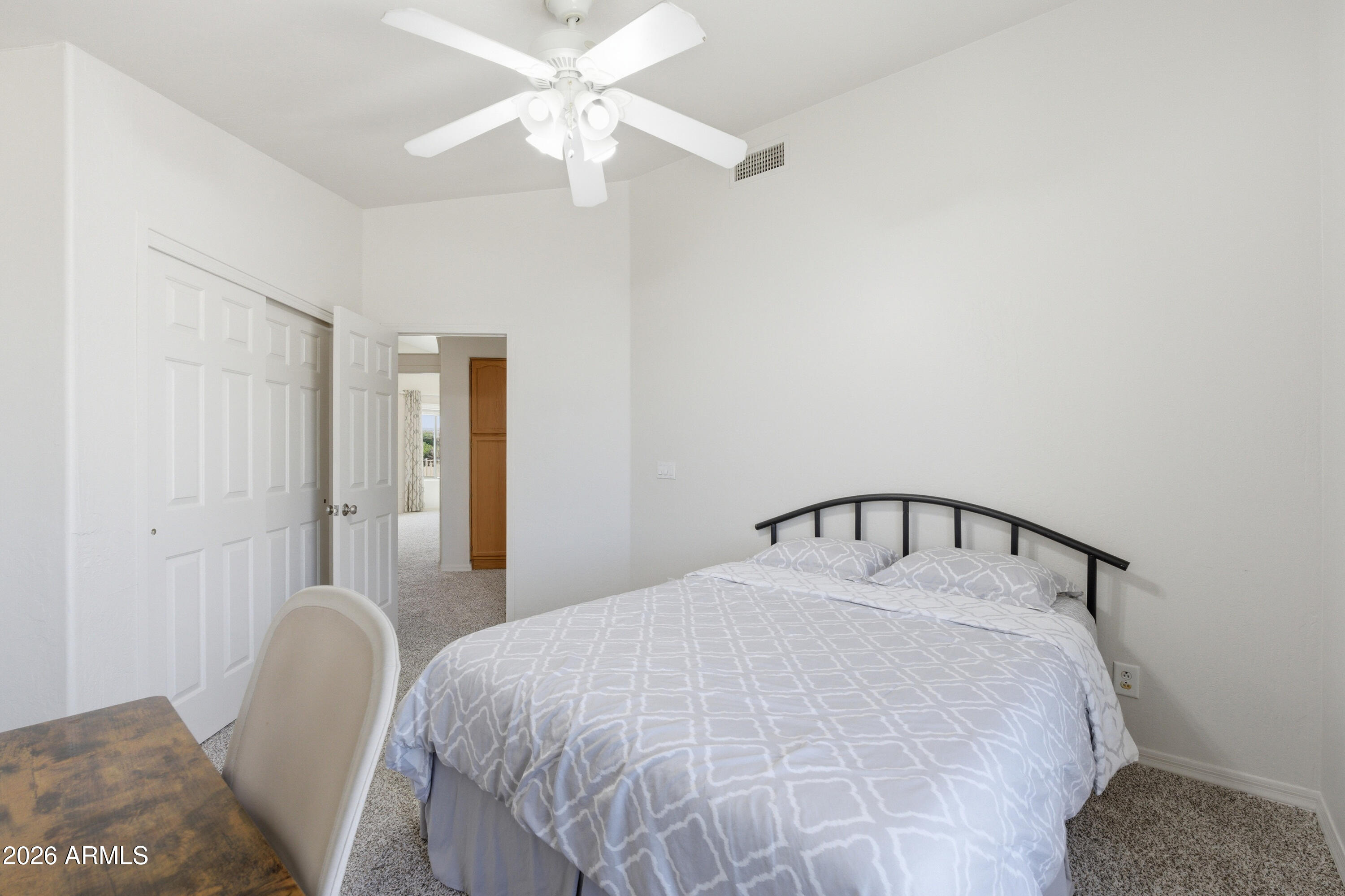 418 South Burk Street Gilbert, AZ 85296 - Photo 50 of 90 a bedroom with a bed and a chandelier