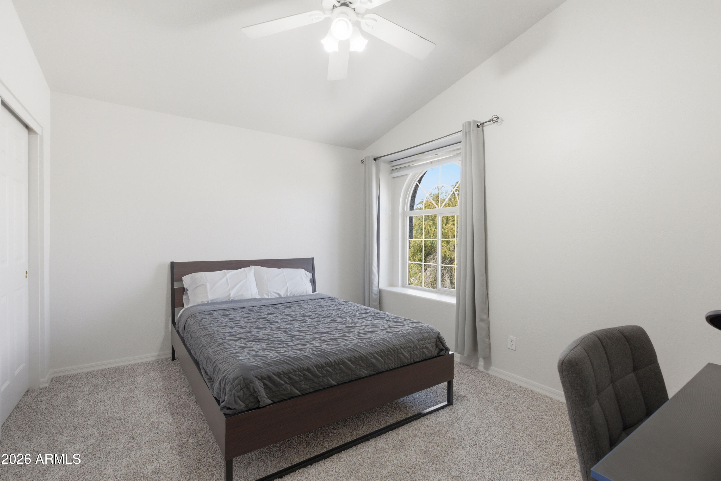 418 South Burk Street Gilbert, AZ 85296 - Photo 52 of 90 a room with a bed and a chair