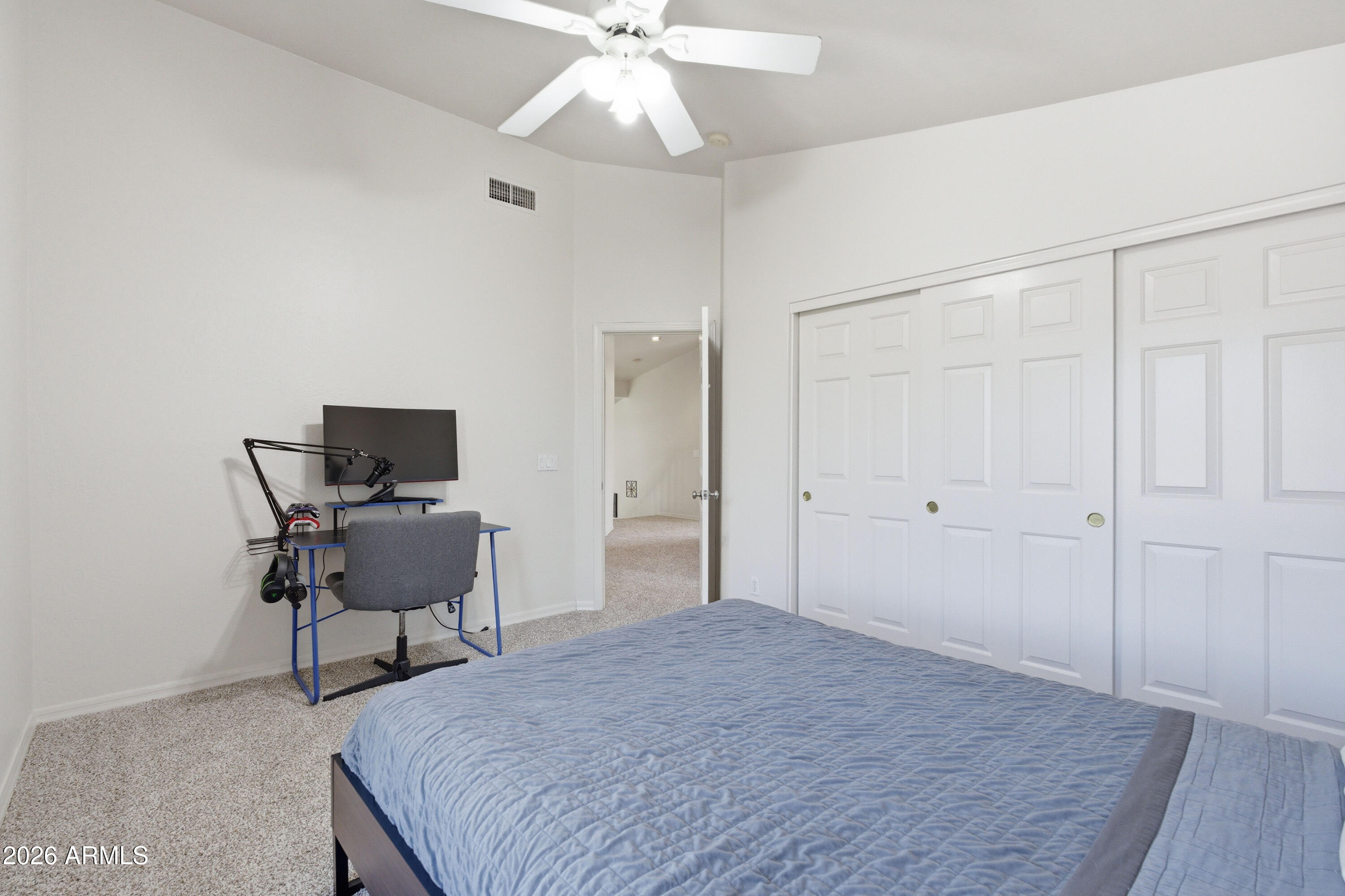418 South Burk Street Gilbert, AZ 85296 - Photo 53 of 90 a bedroom with a bed and a chair