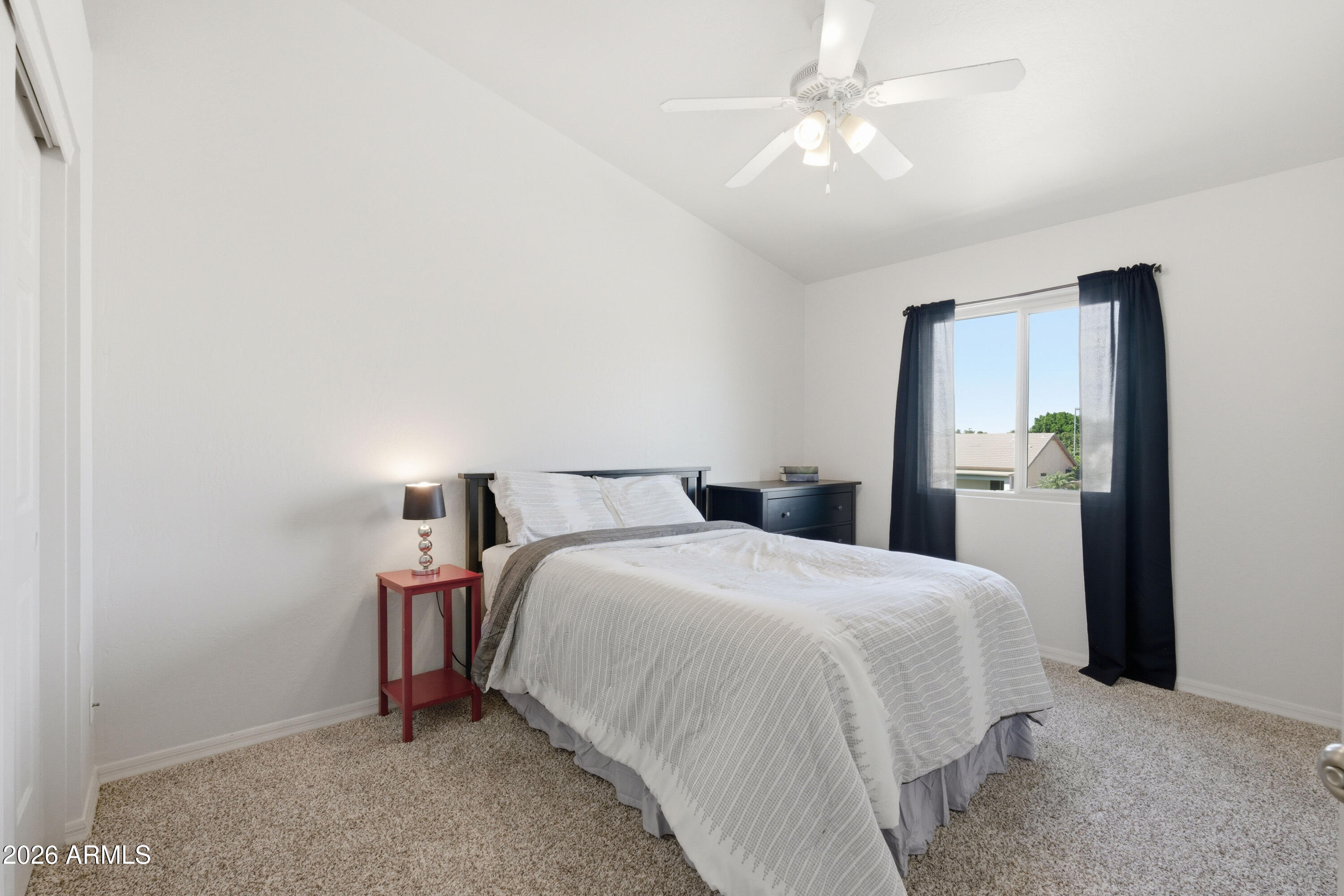 418 South Burk Street Gilbert, AZ 85296 - Photo 54 of 90 a bedroom with a bed and a chandelier