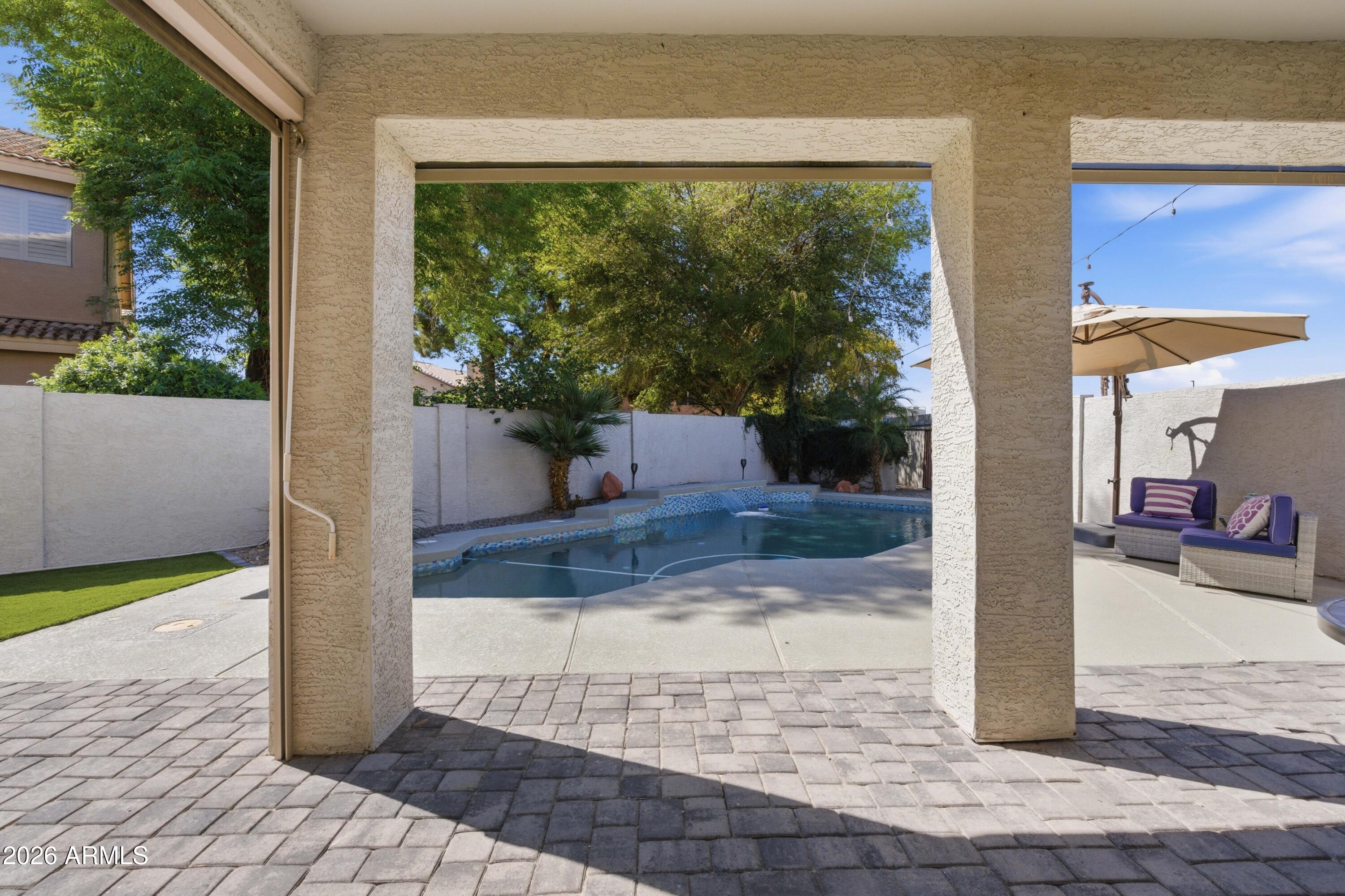 418 South Burk Street Gilbert, AZ 85296 - Photo 56 of 90 a view of a patio with table and chairs