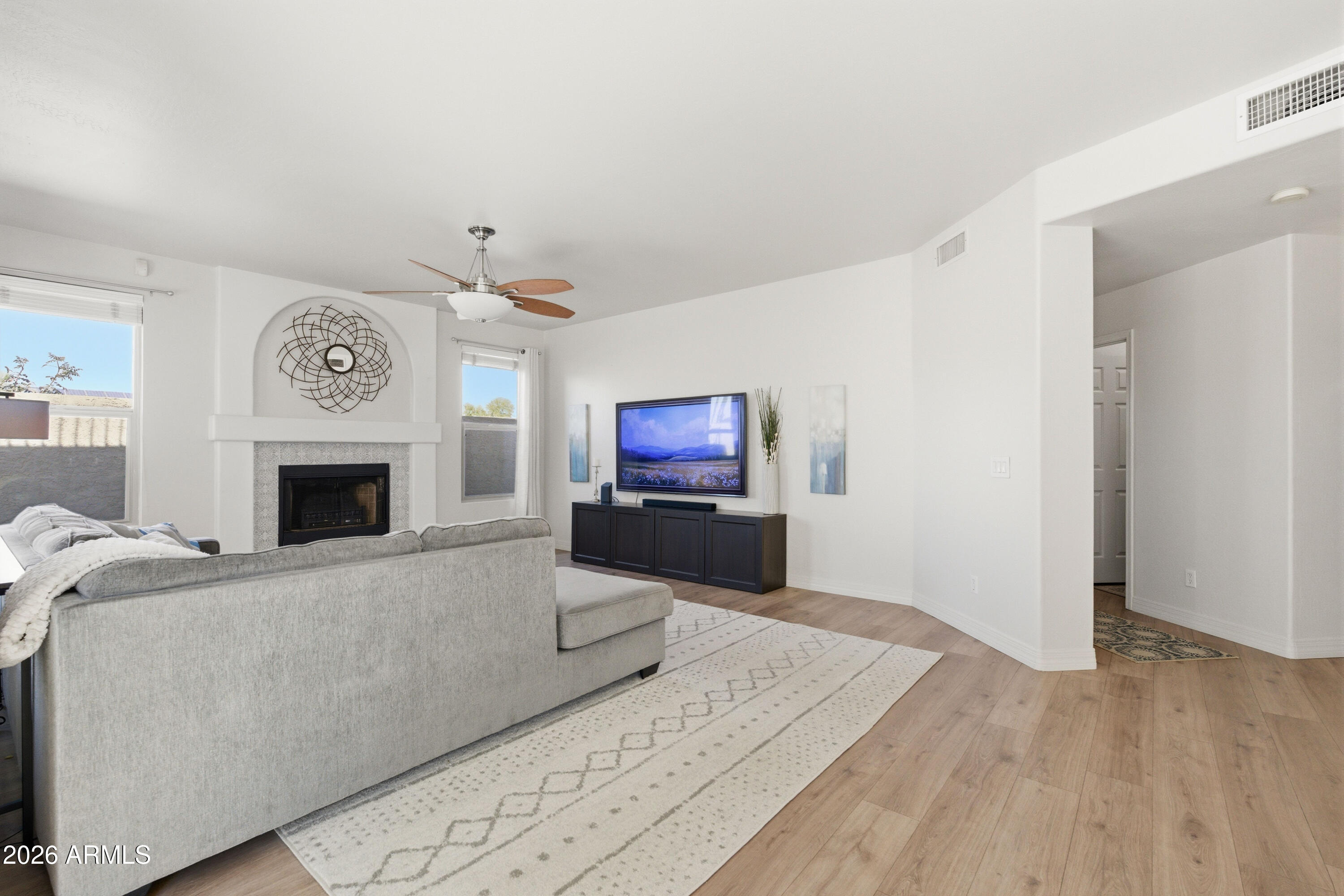 418 South Burk Street Gilbert, AZ 85296 - Photo 6 of 90 a living room with furniture and a fireplace