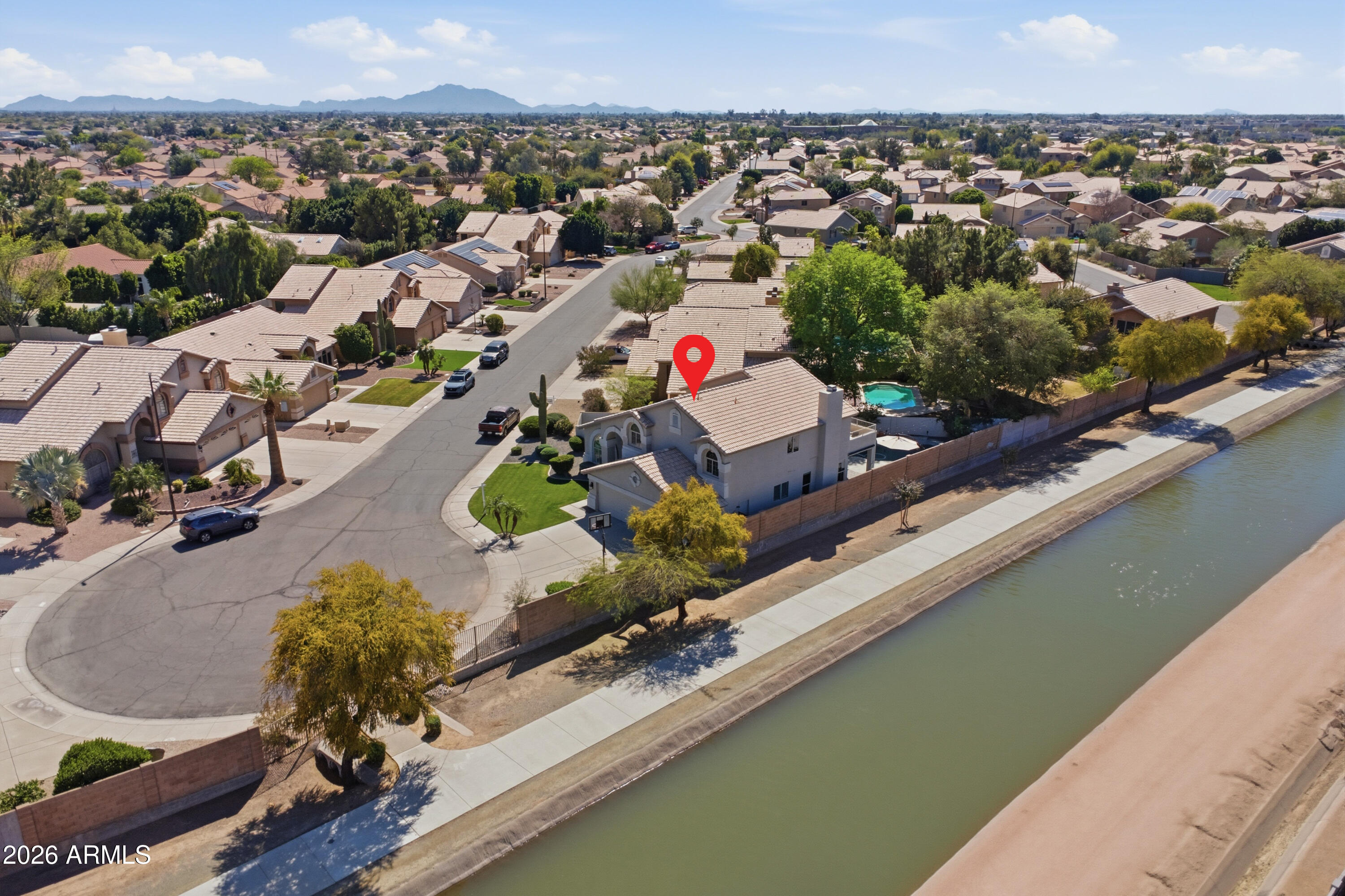 418 South Burk Street Gilbert, AZ 85296 - Photo 74 of 90 an aerial view of a house with a garden and lake view