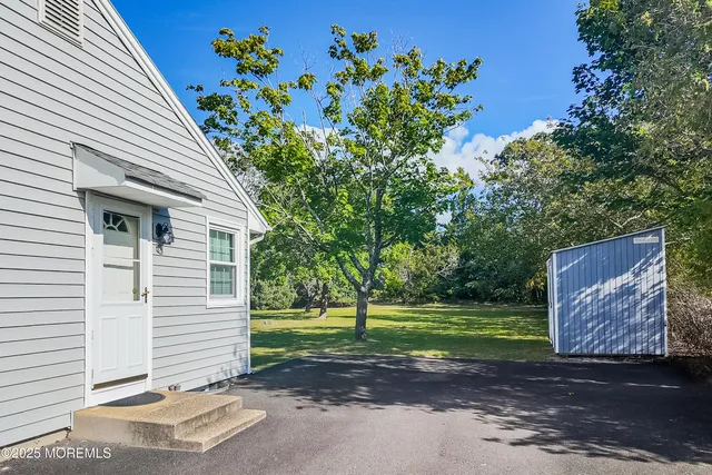 a view of a house with a backyard