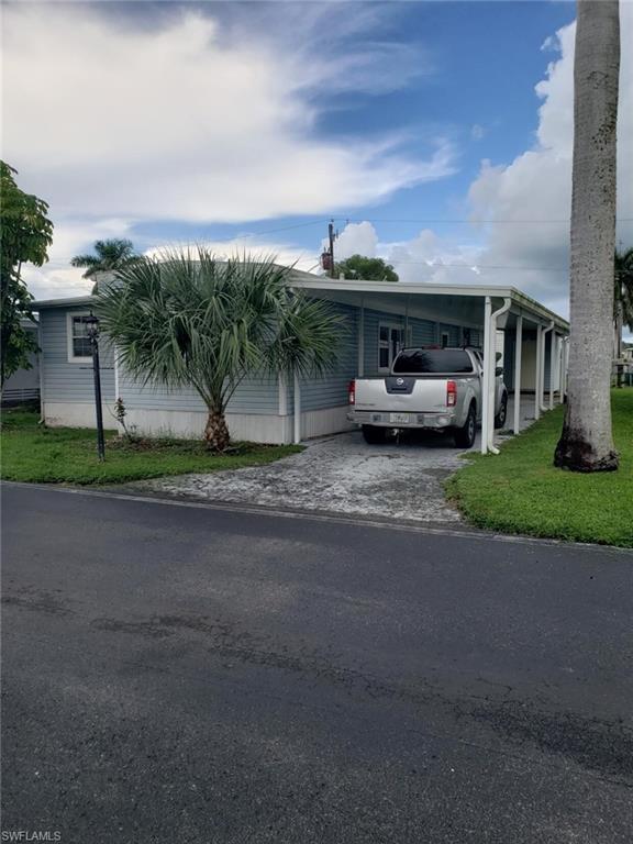 11 Muleshoe Trail, Unit 253 Naples, FL 34113 - Photo 1 of 9 a view of a car parked in front of a house
