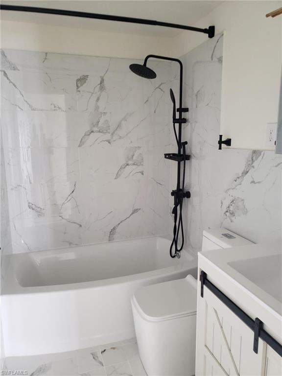 11 Muleshoe Trail, Unit 253 Naples, FL 34113 - Photo 3 of 9 a bathroom with a bathtub and shower
