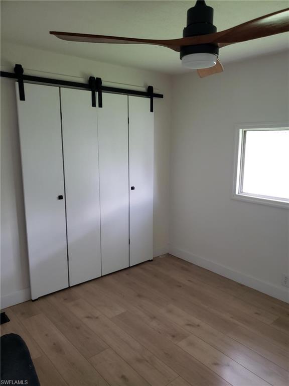 11 Muleshoe Trail, Unit 253 Naples, FL 34113 - Photo 8 of 9 a view of an empty room with a window
