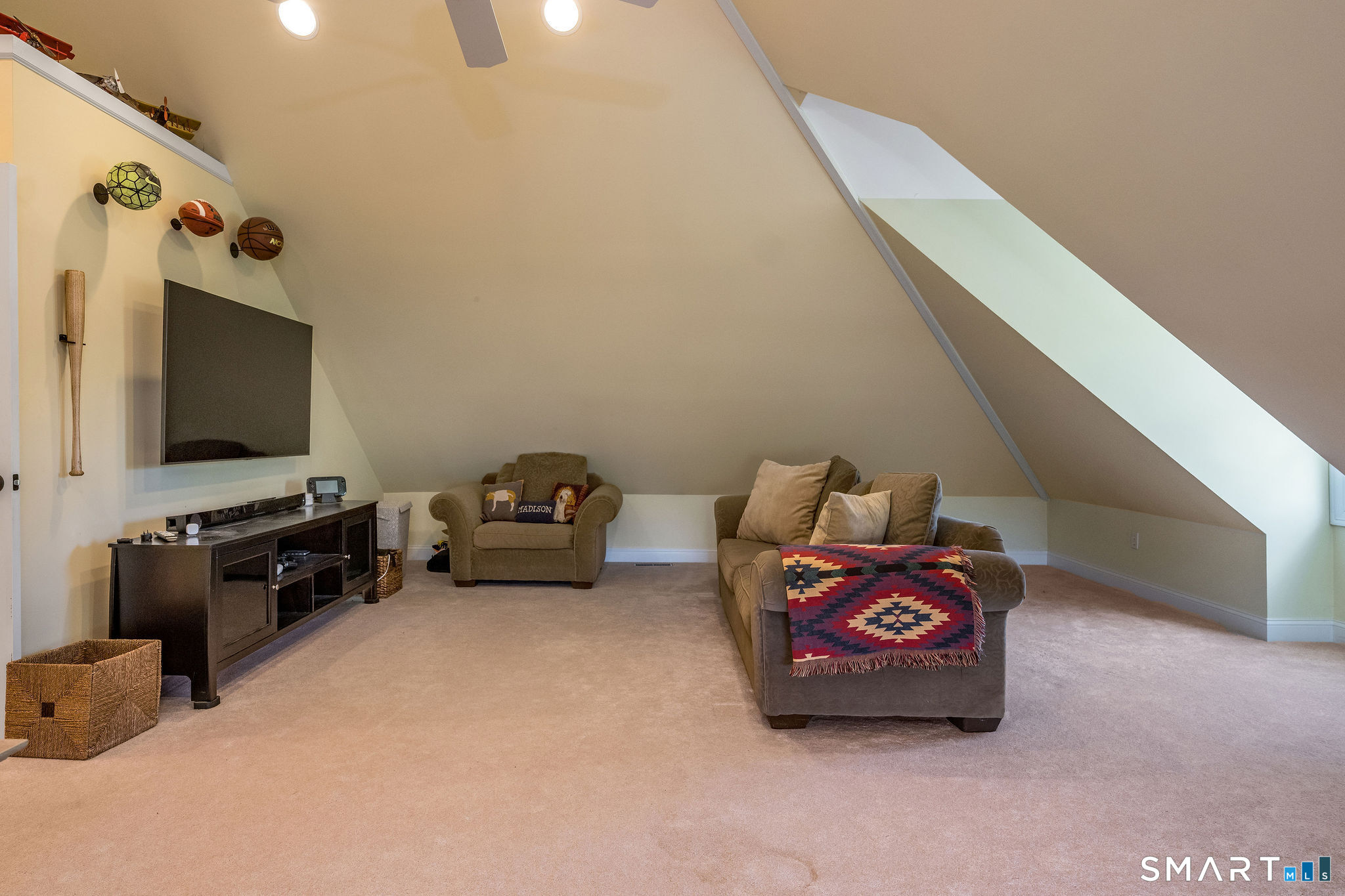 170 Devonshire Lane Madison, CT 06443 - Photo 29 of 39 a living room with furniture and a flat screen tv