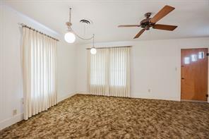 1717 Pipeline Road Cleburne, TX 76033 - Photo 17 of 33 Empty room featuring carpet, plenty of natural light, and ceiling fan