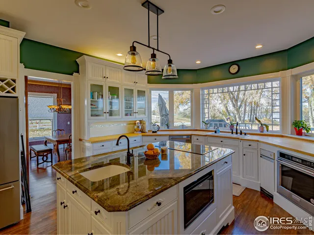 a view of a living room with furniture and window