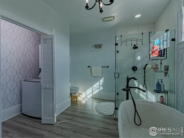 a view of entryway with wooden floor