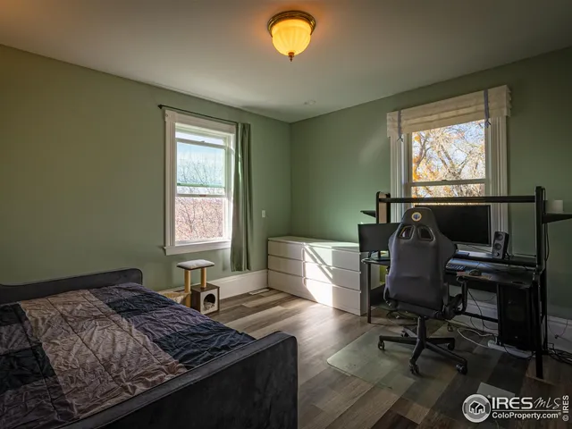 a bedroom with a bed and a bookshelf