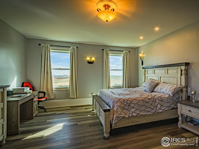 a bedroom with a bed and a fireplace