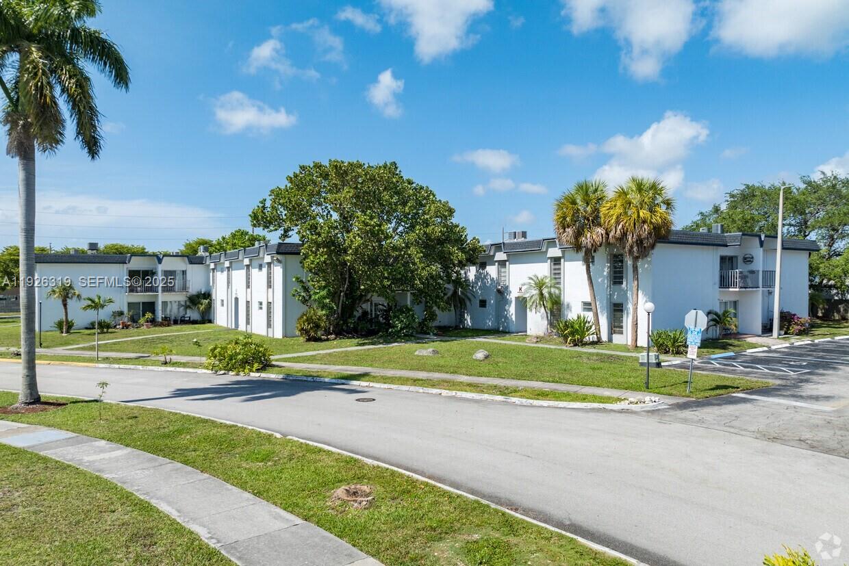 7220 Southwest 94th Place, Unit G4 Miami, FL 33173 - Photo 12 of 12 a view of street with tall buildings