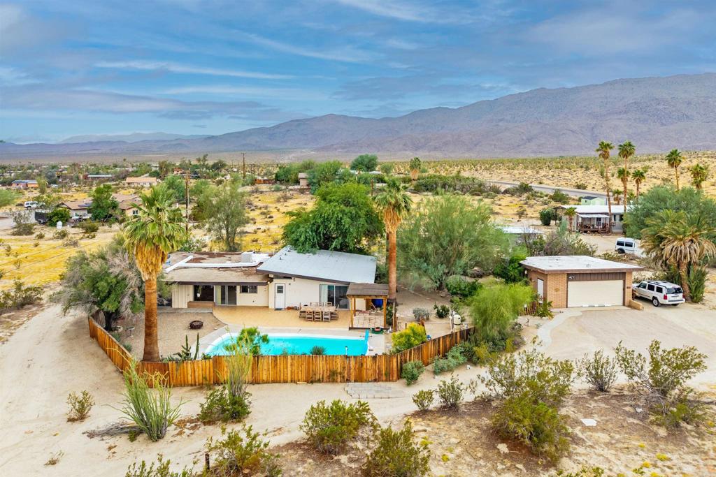 3245 Borrego Springs Road Borrego Springs, CA 92004 - Photo 1 of 25 a front view of a house with a yard swimming pool and outdoor seating