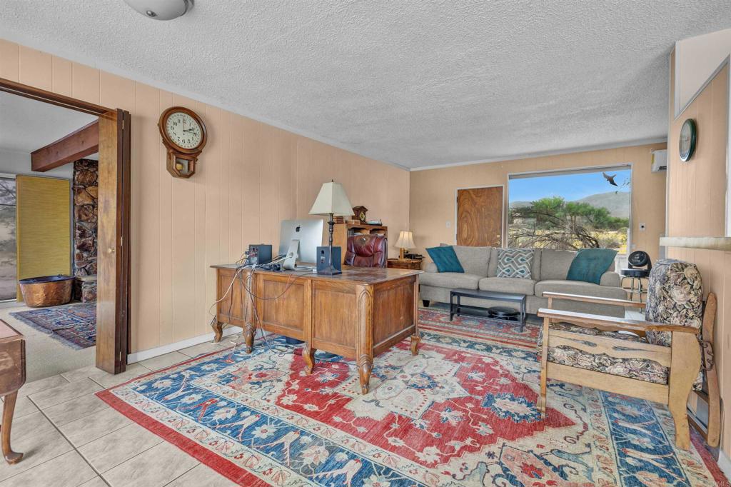 3245 Borrego Springs Road Borrego Springs, CA 92004 - Photo 4 of 25 a living room with furniture and a rug