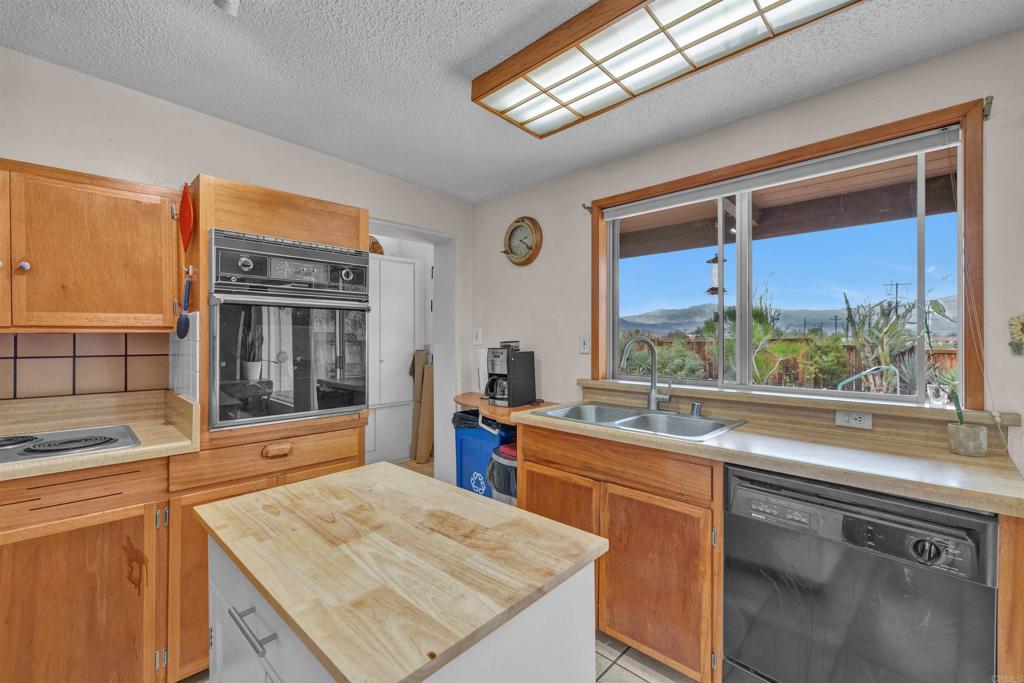 3245 Borrego Springs Road Borrego Springs, CA 92004 - Photo 9 of 25 a kitchen with a sink stove and cabinets