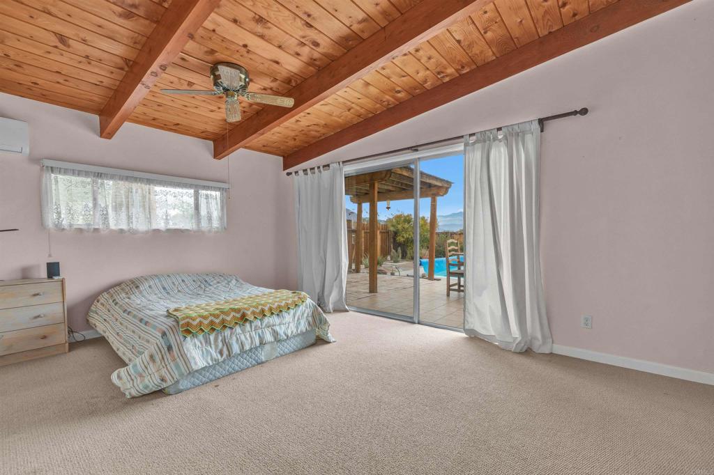 3245 Borrego Springs Road Borrego Springs, CA 92004 - Photo 10 of 25 a spacious bedroom with a bed and a large window