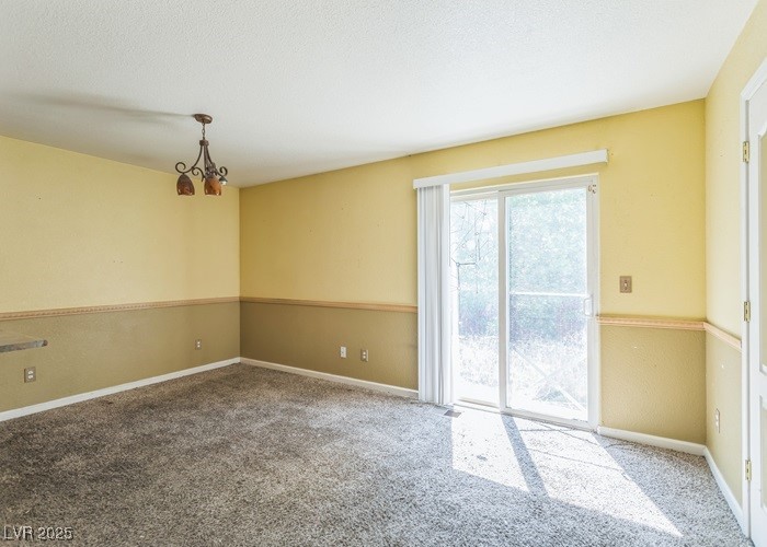 17710 Fairfax Court Reno, NV 89508 - Photo 11 of 19 Empty room featuring a chandelier and carpet floors