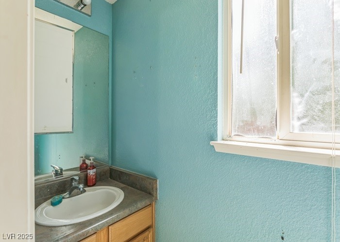 17710 Fairfax Court Reno, NV 89508 - Photo 14 of 19 Bathroom featuring a textured wall and vanity