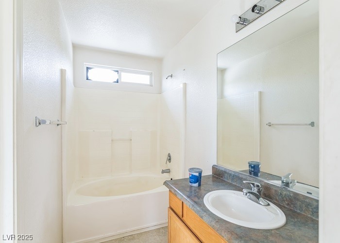 17710 Fairfax Court Reno, NV 89508 - Photo 17 of 19 Bathroom with bathtub / shower combination, vanity, and light tile patterned floors