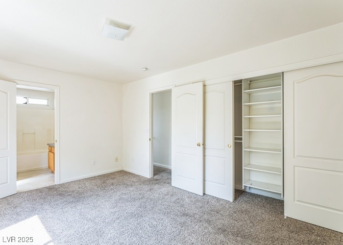 17710 Fairfax Court Reno, NV 89508 - Photo 7 of 19 Unfurnished bedroom with carpet flooring, a closet, and ensuite bathroom