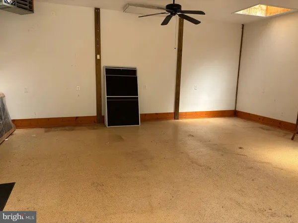 a view of empty room with a fireplace